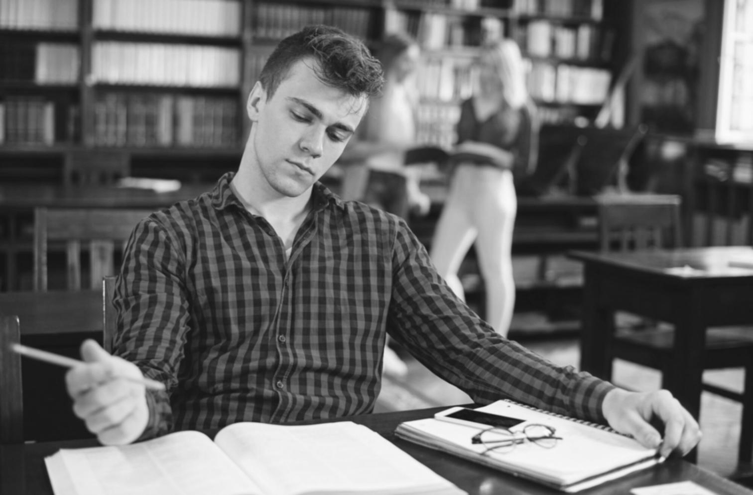 Business professional reviewing financial charts on a laptop